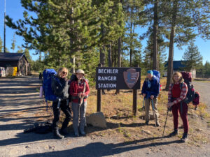 adventures for all group posing by the bechler ranger station sign